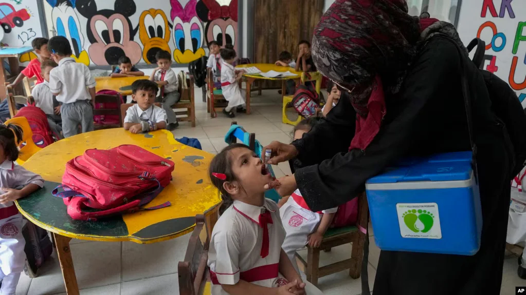 Pakistan and Afghanistan each initiate a separate polio vaccination campaign as cases surge, targeting millions of children at risk.