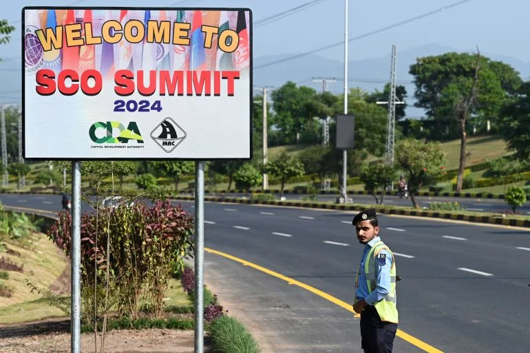 A policeman stands guard at the Red Zone on the eve of the Shanghai Cooperation Organisation summit in Islamabad [AFP]