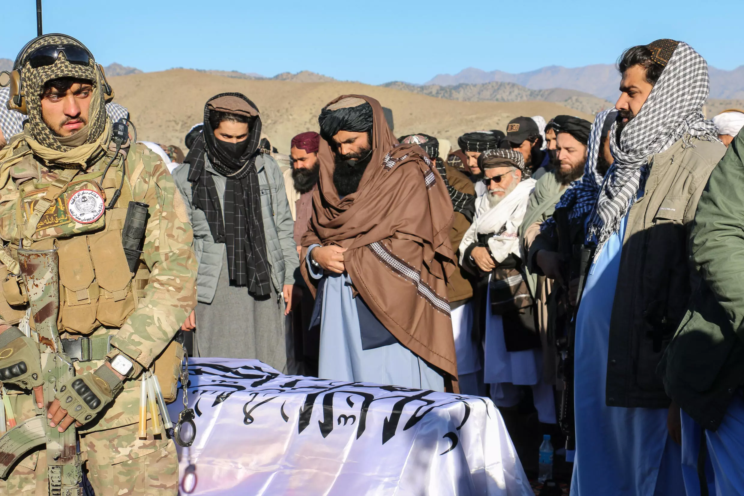 Sirajuddin Haqqani (C), the IEA government's interior minister, attended the funeral ceremony of his uncle, refugees minister Khalil Ur-Rahman Haqqani, who was killed in an attack claimed by the Islamic State group [AFP]