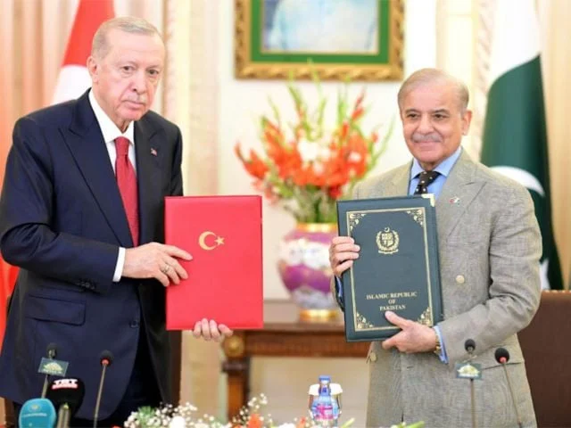 Pakistan and Turkiye signed 24 agreements to enhance bilateral ties in trade, defense, energy, and more during Erdogan's visit. [Image via The Express Tribune]